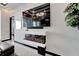 Modern electric fireplace with a sleek white surround at 6542 Simone Shores Cir, Apollo Beach, FL 33572