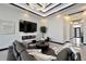 Spacious living room featuring a comfortable sectional sofa and an electric fireplace at 6542 Simone Shores Cir, Apollo Beach, FL 33572