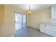 Updated kitchen with white cabinets, and a view to the lanai at 912 Oxford Park Dr, Sun City Center, FL 33573