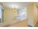 Modern kitchen with white cabinets and a breakfast bar at 912 Oxford Park Dr, Sun City Center, FL 33573
