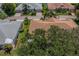 An aerial view of the house and surrounding neighborhood at 912 Oxford Park Dr, Sun City Center, FL 33573