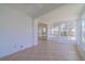Sunroom with tiled floor, ceiling fan and access to backyard at 912 Oxford Park Dr, Sun City Center, FL 33573