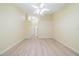 Spacious bedroom with light walls, wood-look floors and access to the bathroom at 912 Oxford Park Dr, Sun City Center, FL 33573