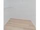 Spacious closet with wire shelving and light wood laminate flooring at 912 Oxford Park Dr, Sun City Center, FL 33573