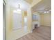 Light and airy entryway with tile floors and built-in shelving at 912 Oxford Park Dr, Sun City Center, FL 33573