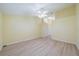 Spacious bedroom with light walls, wood-look floors and access to the bathroom at 912 Oxford Park Dr, Sun City Center, FL 33573