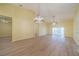 Open living area with high ceilings, ceiling fan, and laminate flooring at 912 Oxford Park Dr, Sun City Center, FL 33573