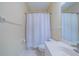 Simple bathroom with white vanity, toilet, and shower/tub combo at 912 Oxford Park Dr, Sun City Center, FL 33573