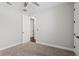 This bedroom features neutral walls, carpet, ceiling fan, and an ensuite bathroom at 4606 W Fig St # 4, Tampa, FL 33609