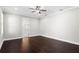 This bedroom features hardwood floors, neutral walls, ceiling fan, and an ensuite bathroom at 4606 W Fig St # 4, Tampa, FL 33609