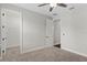 A neutral toned bedroom featuring carpet floors and an adjacent open closet with wire shelving at 4606 W Fig St # 4, Tampa, FL 33609