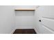 The walk-in closet has wood shelving, is well lit, and has hardwood floors at 4606 W Fig St # 4, Tampa, FL 33609