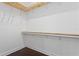 The walk-in closet has wood and wire shelving, is well lit, and has hardwood floors at 4606 W Fig St # 4, Tampa, FL 33609