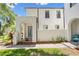 Stunning home featuring a stucco facade, arched entryway, and lush landscaping, creating a welcoming curb appeal at 4606 W Fig St # 4, Tampa, FL 33609