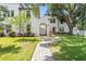 Well-manicured lawn of townhouses with a charming walkway and lush landscaping at 4606 W Fig St # 4, Tampa, FL 33609