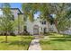 Well-manicured lawn of townhouses with a charming walkway and lush landscaping at 4606 W Fig St # 4, Tampa, FL 33609