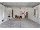 View of a spacious two car garage with visible utilities and concrete floor at 4606 W Fig St # 4, Tampa, FL 33609