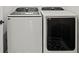 A modern front load Samsung white washer and dryer on tile floors at 4606 W Fig St # 4, Tampa, FL 33609