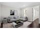 A cozy, modern living room with a sectional sofa, and a window with shutter blinds at 4606 W Fig St # 4, Tampa, FL 33609