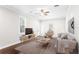 Cozy living room showcasing hardwood floors, natural light, stylish furniture, and a comfortable seating area at 4606 W Fig St # 4, Tampa, FL 33609