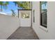 A beautiful side yard with pavers and a privacy fence with a covered opening at 4606 W Fig St # 4, Tampa, FL 33609