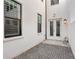 Beautiful side yard with pavers, a security camera and double doors to enter the property at 4606 W Fig St # 4, Tampa, FL 33609