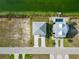 Aerial view of two houses near the water at 3431 Sheephead Dr, Hernando Beach, FL 34607