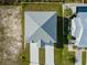 Top-down view of a house with a gray roof and driveway at 3431 Sheephead Dr, Hernando Beach, FL 34607
