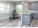 Modern kitchen with gray cabinets, stainless steel appliances, and granite countertops at 3431 Sheephead Dr, Hernando Beach, FL 34607