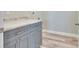 Modern laundry room with gray cabinets and quartz countertops at 3431 Sheephead Dr, Hernando Beach, FL 34607