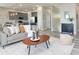 Open concept living room featuring a modern kitchen and hardwood floors at 3431 Sheephead Dr, Hernando Beach, FL 34607