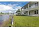 Backyard oasis with expansive waterfront views and lush grass at 3431 Sheephead Dr, Hernando Beach, FL 34607