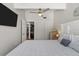 King bedroom with large windows, ceiling fan, and access to private laundry at 5030 N Beach Rd # 2, Englewood, FL 34223