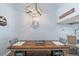 Dining area with a rustic wooden table, and decorative wall art at 5030 N Beach Rd # 2, Englewood, FL 34223