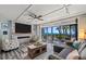 Ocean view living room with fireplace and comfy seating at 5030 N Beach Rd # 2, Englewood, FL 34223