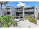 Modern coastal condo building with multiple units and private decks at 5030 N Beach Rd # 2, Englewood, FL 34223