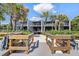 Backyard with wooden walkway to beach, and modern beach home at 5030 N Beach Rd # 2, Englewood, FL 34223