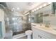 Elegant bathroom with a large walk-in shower and modern vanity at 5030 N Beach Rd # 2, Englewood, FL 34223
