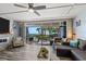 Spacious living room showcasing ocean views and sliding glass doors at 5030 N Beach Rd # 2, Englewood, FL 34223