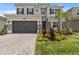 Two-story home with a two-car garage and attractive landscaping at 32588 Tree Of Life Ave, Wesley Chapel, FL 33543