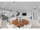 Open concept kitchen and dining area with large island at 32588 Tree Of Life Ave, Wesley Chapel, FL 33543