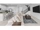 Open concept living room with sectional sofa and kitchen view at 32588 Tree Of Life Ave, Wesley Chapel, FL 33543