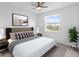 Spacious bedroom with large window, plush bedding, and nightstands at 32588 Tree Of Life Ave, Wesley Chapel, FL 33543