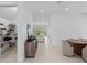 Bright entryway with storage, dining area, and view into living room at 32588 Tree Of Life Ave, Wesley Chapel, FL 33543