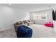 Versatile bonus room with sectional sofa and beanbag chairs at 32588 Tree Of Life Ave, Wesley Chapel, FL 33543