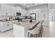 Spacious kitchen featuring an island and stainless steel appliances at 32588 Tree Of Life Ave, Wesley Chapel, FL 33543