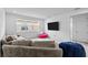 Spacious bonus room with sectional sofa and beanbag chairs at 32588 Tree Of Life Ave, Wesley Chapel, FL 33543