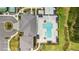 Resort-style pool with plenty of lounge chairs and umbrellas at 32588 Tree Of Life Ave, Wesley Chapel, FL 33543