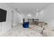 Bright bonus room with sectional sofa, beanbag chairs, and TV at 32588 Tree Of Life Ave, Wesley Chapel, FL 33543