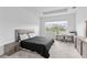 Spacious bedroom with large window and workspace at 32588 Tree Of Life Ave, Wesley Chapel, FL 33543